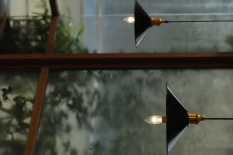 Two decoration lamps on ceiling with window view Stock Photos