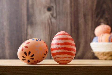 Two Decorative Easter Eggs on Wooden Shelf Stock Photos