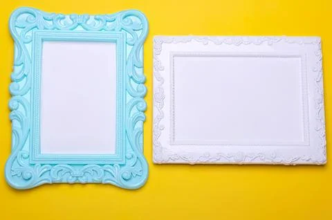 Two decorative picture frames on yellow background Stock Photos