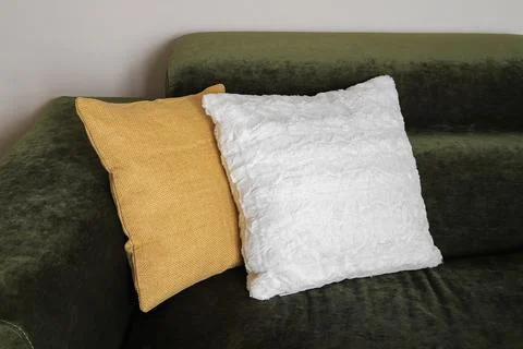 Two decorative pillows on the sofa Stock Photos