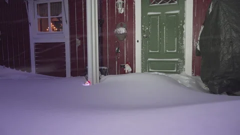 Two decorative snowmen - one plastic with light and another wooden Stock Footage 147410498