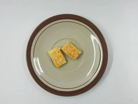 Two delicious cheese cookies on a rustic plate Stock Photos