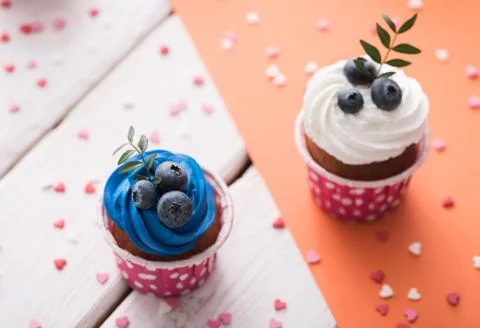 Two delicious cupcakes on a table 스톡 사진
