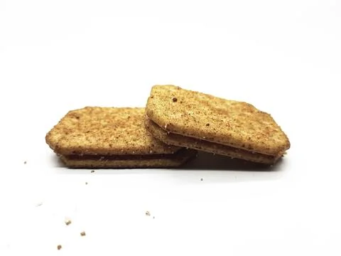 Two delicious rectangular sandwich cookies stacked on a white background 写真素材