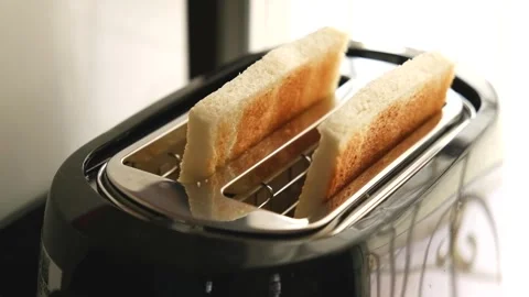 Two delicious toasted bread pop out of the toaster 스톡 동영상 289439639