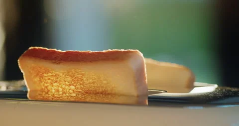 Two delicious toasted pieces of bread pop out of the toaster. Lit by the morning Stock Footage 256213049