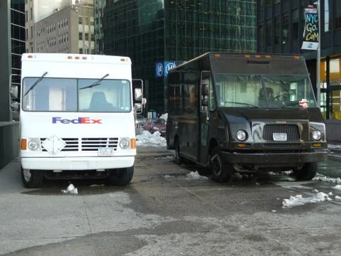 Two delivery trucks side by side Stock Photos