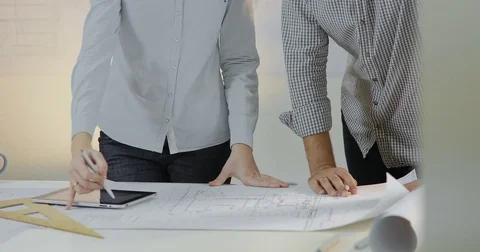 Two design engineers have a working meeting about project Stock Footage 81666972