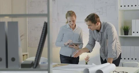 Two design engineers have a working meeting about project Stock Footage 81667238