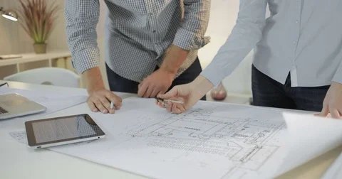 Two designers are working on the project in the office Stock Footage 81577289