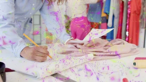 Two designers checking patterns, marking fabric, cutting fabric for fashion, Stock Footage 333033865