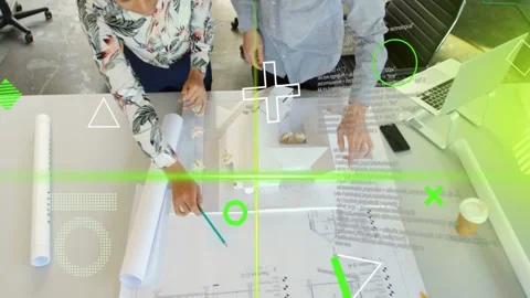 Two designers unrolling plans, tracing and aligning scaled model, consulting Stock Footage 333657029