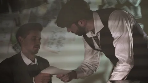 Two detectives argue while checking investigative records Stock Footage 120364632