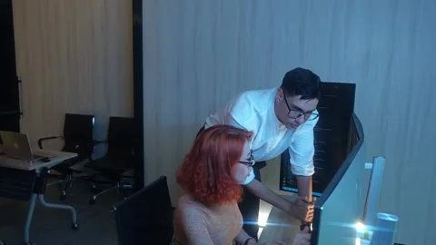 Two developer colleagues collaborating on programming and data analysis usi.. Stock Footage 316042042