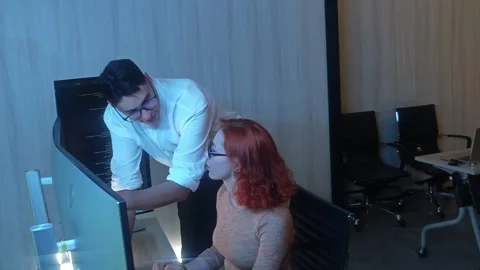 Two developer colleagues collaborating on programming and data analysis usi.. Stock Footage 316042043