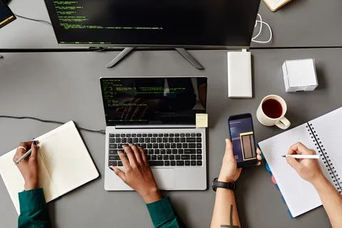 Two Developers Writing Code Top View Stock Photos