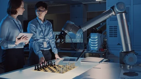 Two Development Engineers are Discussing and Testing an Artificial Intelligence Stock Footage 105349538