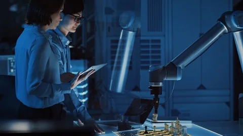 Two Development Engineers are Discussing and Testing an Artificial Intelligence Stock Footage 105351047