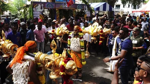 Two devotees perform Kavadi dance at street. Stock Footage 132772453