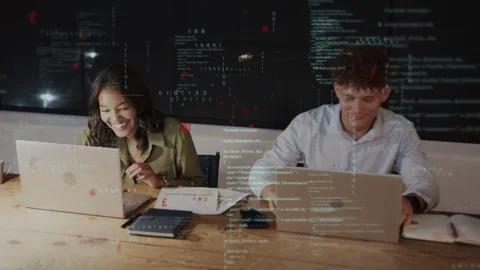 Two devs after task, fist bumping and high five, resuming while code overlay Stock Footage 335282105