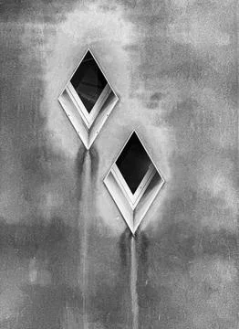 Two Diamond-Shaped Windows In Black And White Stock Photos
