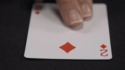 Two of Diamonds playing card, moving on a luxury black background 4k. Stock Footage 95574452