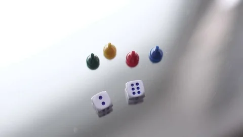 Two dice and four chips in the mirror Stock Footage 72548250