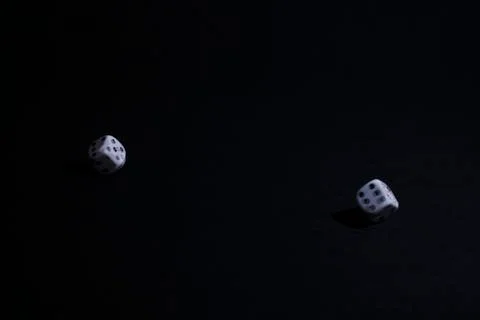 Two dice on black background Stock Photos