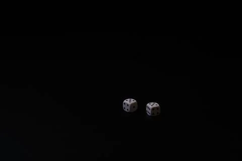Two dice on black background Stock Photos