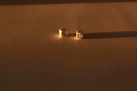 Two dice on golden background Stock Photos