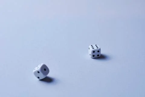Two dice in motion, on white background, Stock Photos