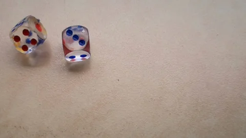 Two dice spin on the floor. (slow motion footage 960fps) Stock Footage 110984862