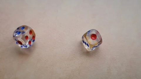 Two dice spin on the floor. (slow motion footage 960fps) Stock Footage 110985032
