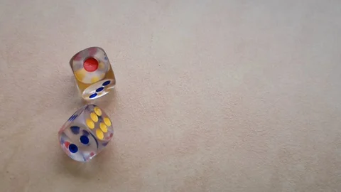 Two dice spin on the floor. (slow motion footage 960fps) Stock Footage 110985152