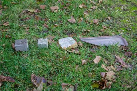 Two different blocks or cobblestones next to piece of wall and broken clay Stock Photos
