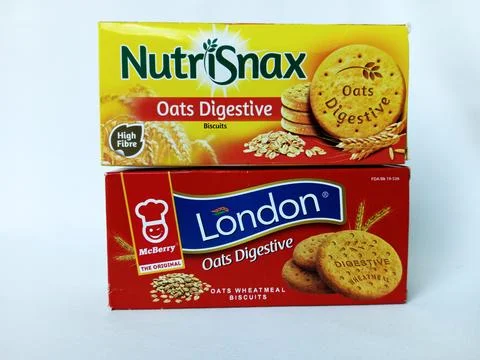 Two different brand boxes of oats digestive biscuits. Stock Photos