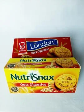 Two different brand boxes of oats digestive biscuits. Stock Photos