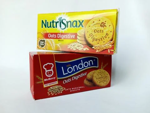 Two different brand boxes of oats digestive biscuits. Stock Photos