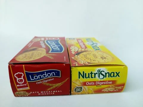Two different brand boxes of oats digestive biscuits. Stock Photos