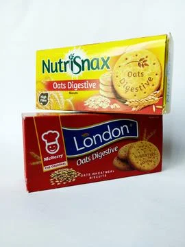 Two different brand boxes of oats digestive biscuits on white background. Stock Photos