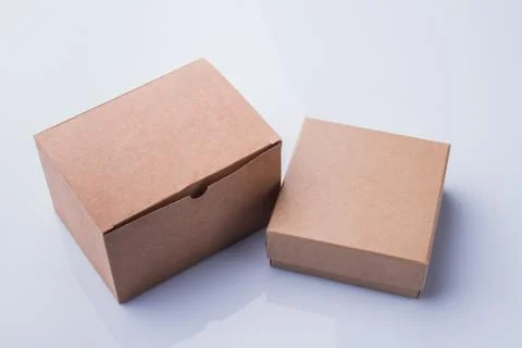 Two different cardboard boxes isolated on white. Stock Photos