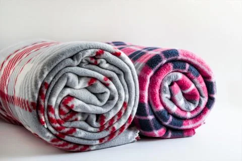 Two different color and size soft fleece blankets on the white Stock Photos