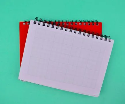 Two different color note paper diary placed on top of each other on a paper Stock Photos