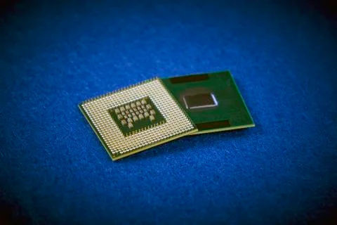 Two different CPUs showing different types of connections on blue background Stock Photos