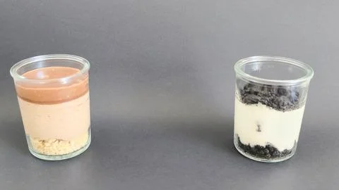 Two different dessert jars placed apart Stock Photos