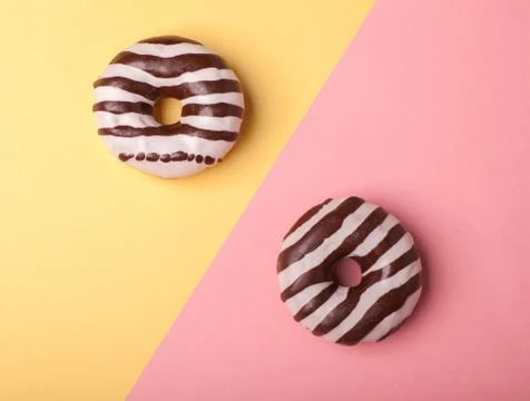 Two different donuts isolated on bright background Stock Photos