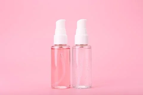 Two different face lotion, liquid foam or gel for skin cleaning in transparent Stock Photos