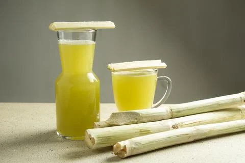 Two different glasses filled with real sugar cane juice Stock Photos