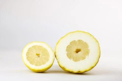 Two different half lemons cut in section Stock Photos