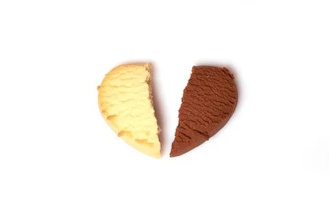 Two different halves of lemon and chocolate cookies in the shape of a heart Stock Photos